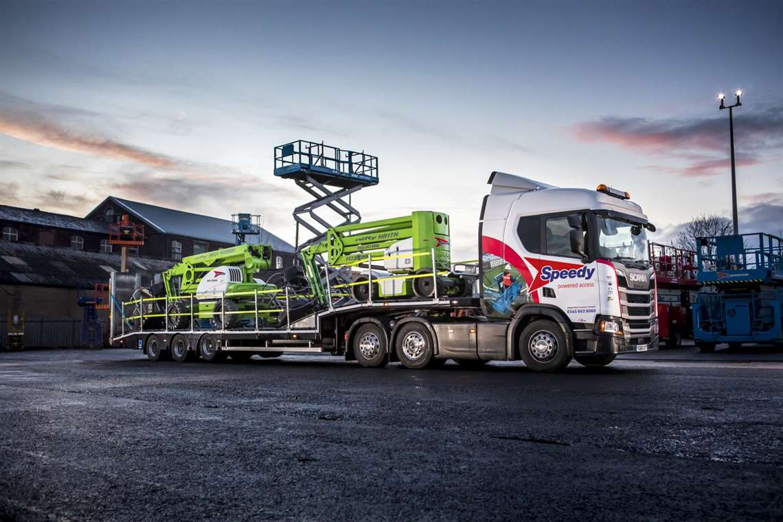 Two NiftyLift booms on a Speedy Powered Access transport trailer
