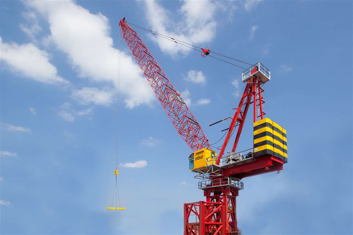 Favelle Favco's new MK380F-H12 in red with a yellow cabin, boom up, against a bright blue sky 