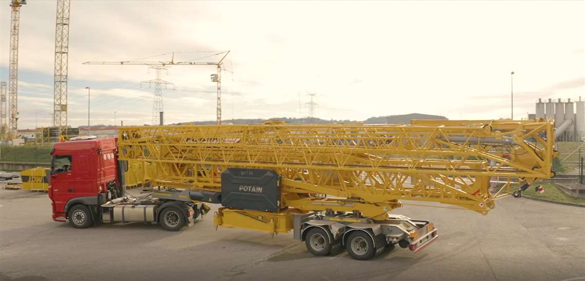 Folded Potain tower loaded for transport