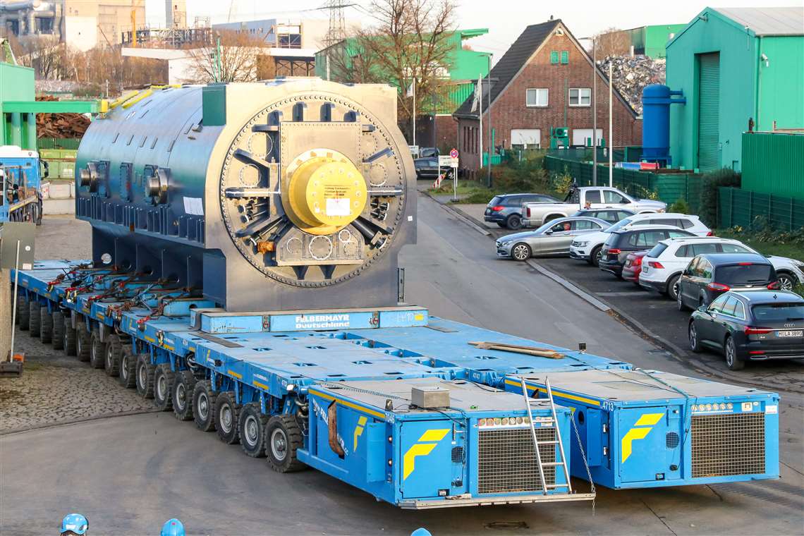 Two rows of 18 axle lines of SPMT carried the generator to its final destination