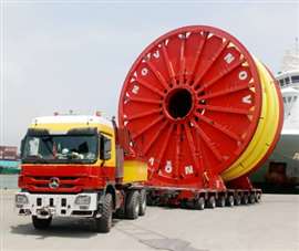 Red and white Cranes 'R' Us truck and transporter