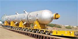 A reactor being transported by specialist trailer