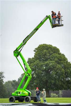 3.	The photographer, left, and Star Platforms operative Darren Waistnedge in the Niftylift HR21 all-terrain cherry picker, preparing to snap the giant sign and visiting soccer stars