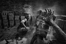 men carrying bricks