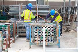 Members of the ScaffSource team do inventory on material returns from customers.