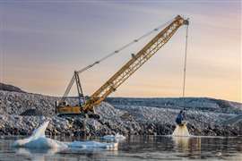 Munck Civil Engineering is using a Liebherr HS8200 duty cycle crawler crane to dredge the seabed in Ilulissat,  Greenland, ahead of the construction of a new airport
