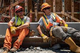Construction workers take a shade break