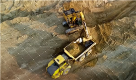loader filling a hauler with aggregate