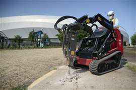 Toro's Dingo TX-1000 Turbo with a powerful breaker attachment