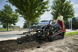 The Dingo TX-1000 Turbo undertaking trenching work
