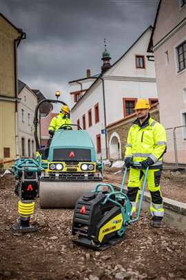 A range of Ammann eDrive equipment on an urban jobsite