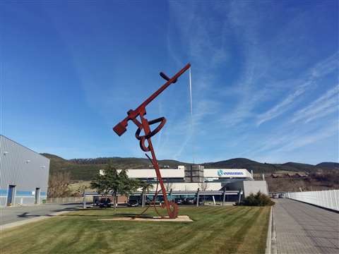 Rusty iron crane-like sculpture