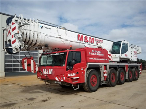 White and red five axle all terrain crane