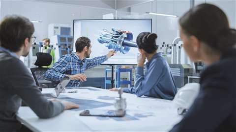 Research and development team review product on screen