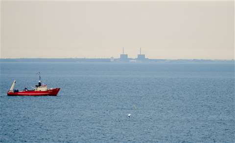 A ship on the Øresund strait with Barsebäck Nuclear Power Plant in the background