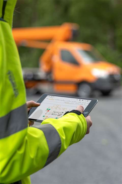 An onsite worker using a smart device to view the RTC
