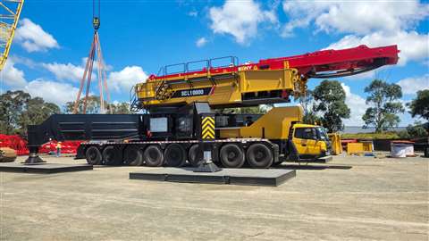 assembling red and yellow Sany crane