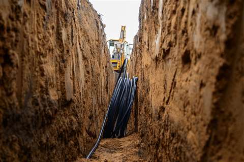 HDPE pipes in an unsupported trench ahead of installation 