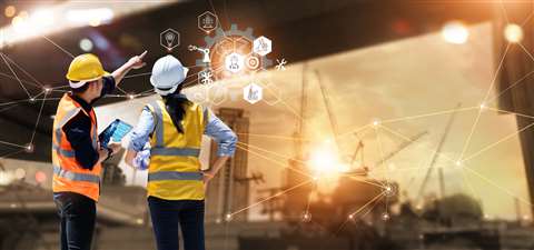 Workers in construction using technology