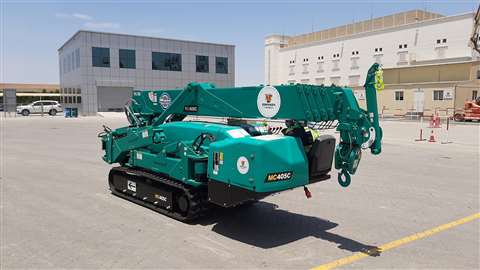 Turquoise Maeda mini spider cranes join the Johnson Arabia rental fleet. Pic shows round Johnson Arabia sticker on the side of the crane