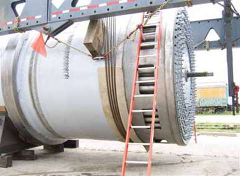 On saddles at the shop, the dryer has been attached by suspension cables to the transporter and is r