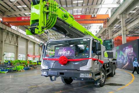 Zoomlion ZTC250N-EV fully electric 25 tonne capacity truck crane green and grey, red garland, at end of the production line