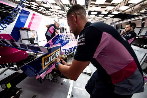 A SportPesa Racing Point F1 team engineer puts the new JCB tools to the test