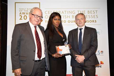 Douglas Anderson and his wife Khadija Anderson are pictured collecting the award from Mike Kennedy, Director of Western Pension Solutions, who sponsored the category