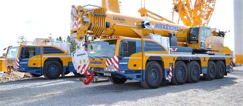 A pair of new Demag AC 220-5 all terrains for Windhoist painted in yellow and blue Tadano Demag colours