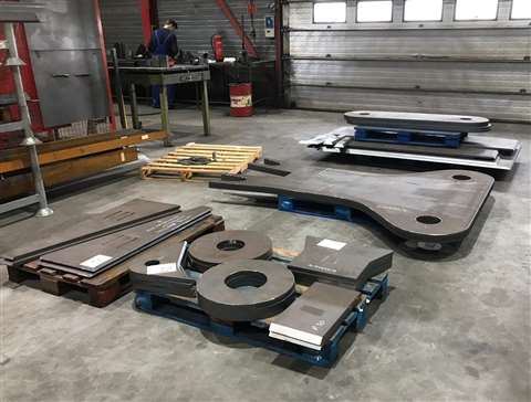 The first pieces of the Mammoet Focus 30 crane cut and laid out in the fabrication shop