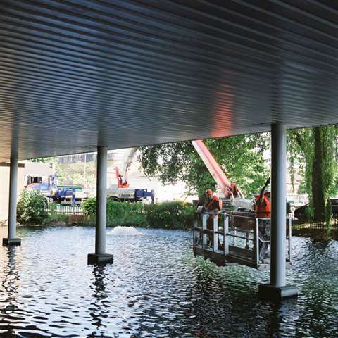 The Wilson Access Palfinger P570 truck mount negotiates the lake at Northampton Saints Rugby Club. 
