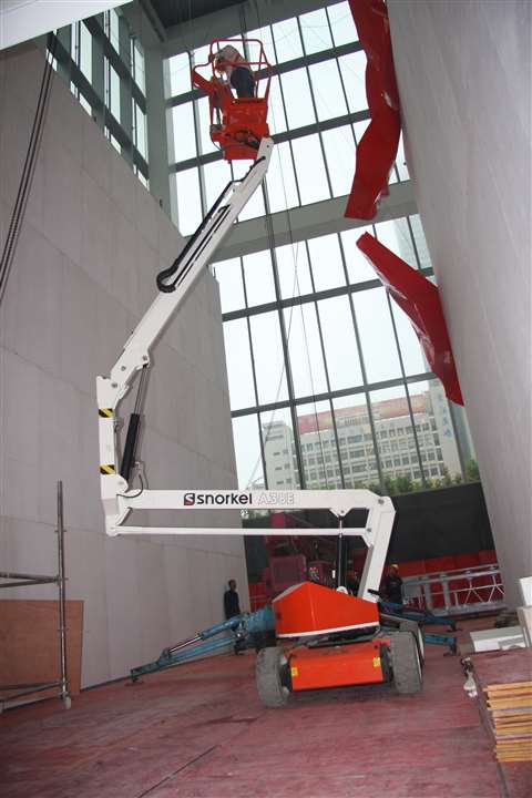 A Snorkel A38E installs artwork at the Jing An Kerry Centre in Shanghai