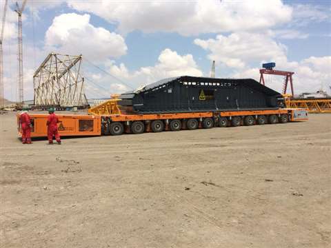 Two Kamag K24 6-axle modules coupled longitudinally to transport heavy crane parts at BOS-Shelf LLC 