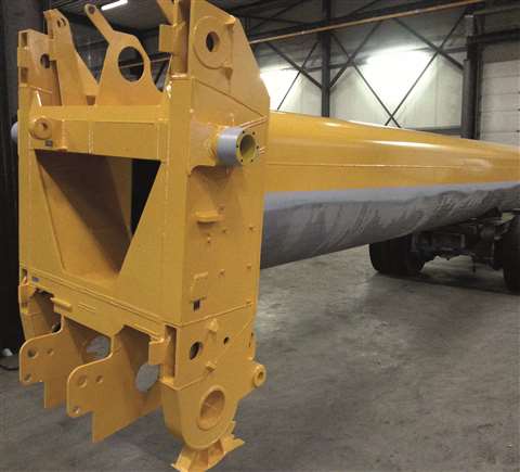 Newly yellow painted telescopic boom head section after repair in a workshop