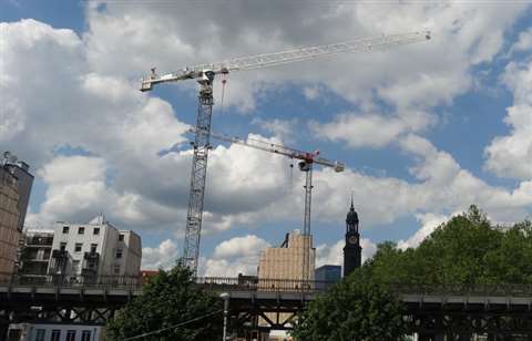 The two Terex tower cranes in view of the world-famous St Pauli Landungsbrücken Piers in Hamburg
