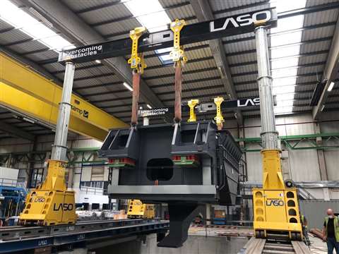 Inside a clean and bright automotive components factory Laso moves a press with its SBL500 telescopic hydraulic lifting gantry