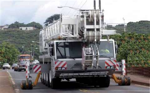 Traffic backs up as the Demag AC 120 cautiously makes its way over the Hanapepe bridge