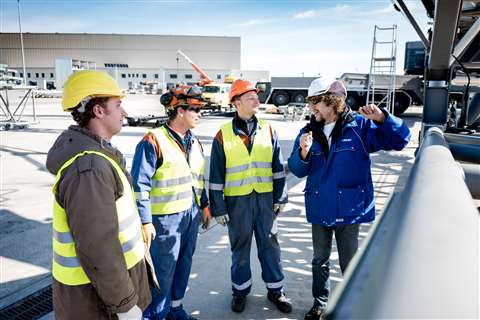 Operator training at Liebherr-werk Ehingen in Germany people in hard hats being trained outdoors