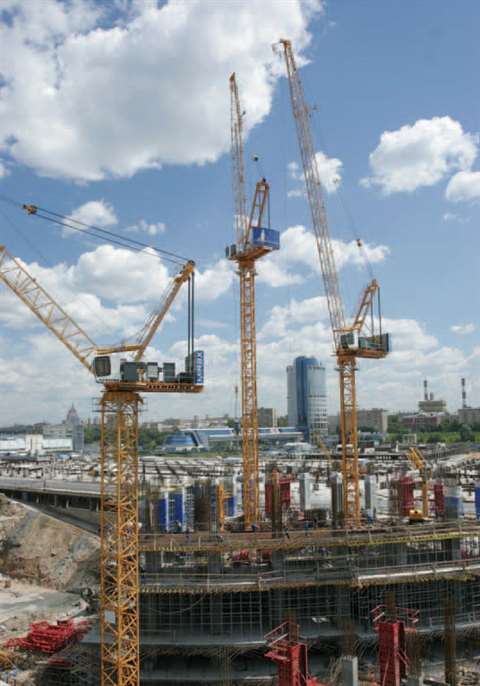 The first three tower cranes pictured during the early stages of construction. The two taller 160 HC