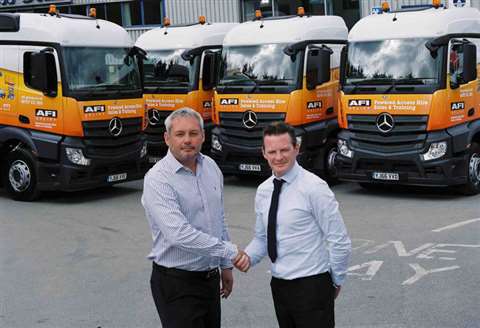 AFI director Nick Higgins (left) receives some of the new delivery vehicles from Tony Birtwistle, of