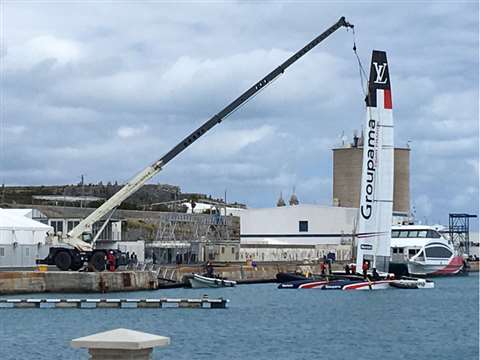 Team Franceâ€™s yacht being lowered into the water for the Americaâ€™s Cup in Bermuda using a Terex 
