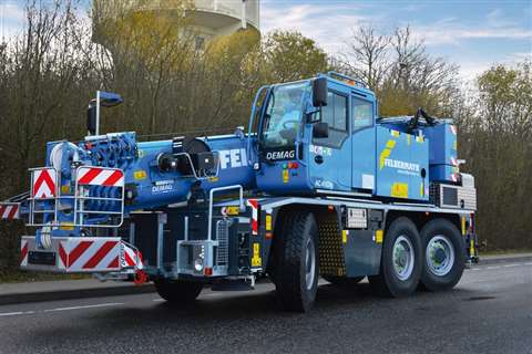 Demag AC 45 City three axle wheeled mobile crane in the light blue and yellow Felbermayr colours