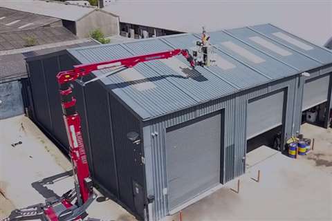 The Hinowa Lightlight 33.17 tracked boom in operation over warehouse