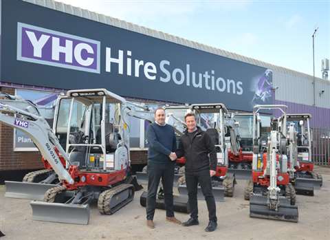 YHC operations director Jim Patch (L) and CBL Plant area sales manager Phil Hooper (R shake hands on