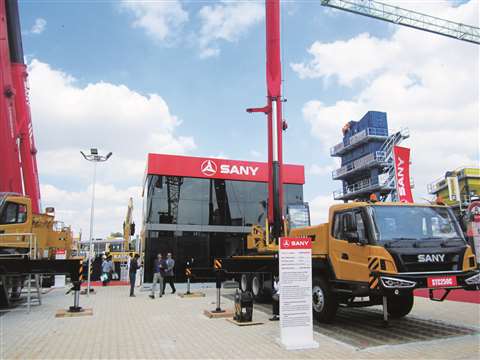 Sany STC 250C truck crane boom up, booth building behind
