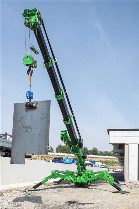 The first model in Palazzani's Palcrane range of mini crawler cranes, lifting a concrete panel