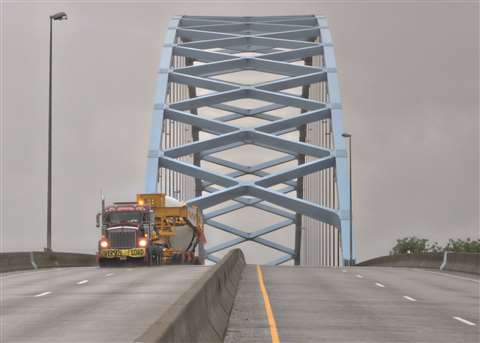 Maxim Crane Works dual-lane trailer travels over suspension bridge