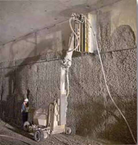 Conjet hydrodemolition robots worked to remove fire-damaged concrete from a tunnel in the Newhall Pa