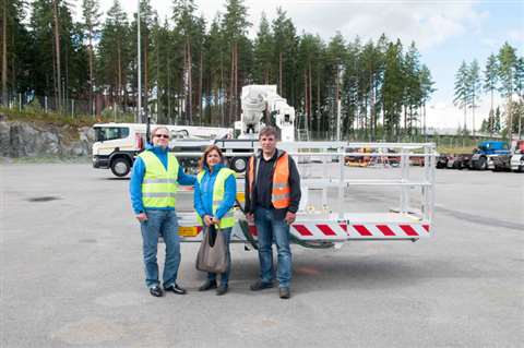 Roland and Monica Berteit, with their new Bronto S70XR truck mount, next to Thomas Mayr from Bronto 