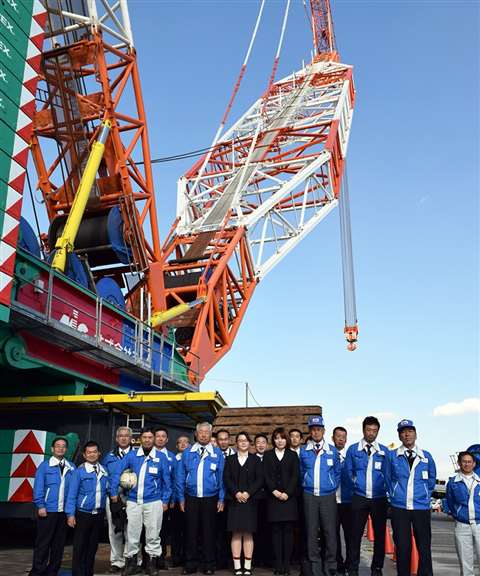 A crowd stands in its shadow at the handover ceremony for MIC's fourth Tadano Demag CC 8800-1 crawler crane